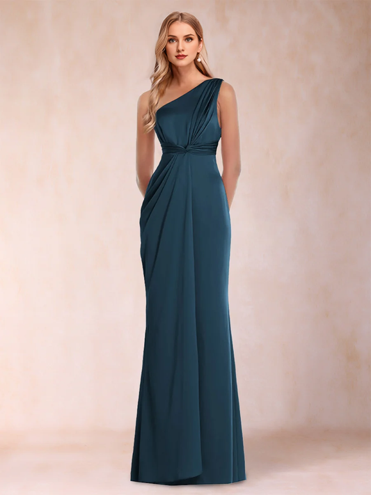 Tight fitting straight tube with one shoulder pleats and ground length ruffled edges for evening gowns