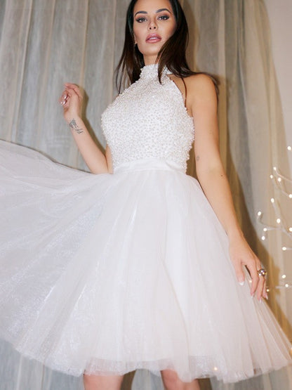 A-Line/Princess Sleeveless Halter Beading Tulle Short/Mini Homecoming Dresses